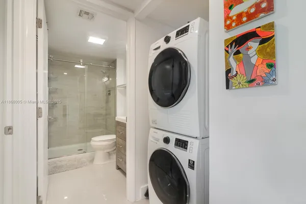 a view of a hallway with washer and dryer