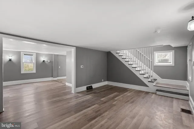 a view of an entryway with wooden floor