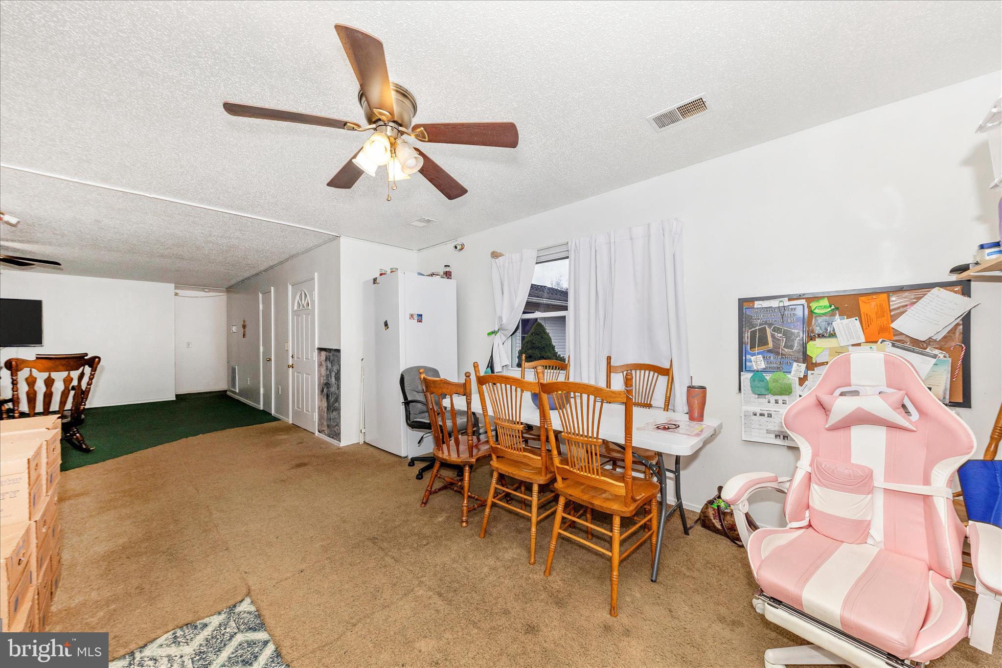 2915 Fry Road Jefferson, MD 21755 - Photo 13 of 66 a living room with furniture a ceiling fan and a rug