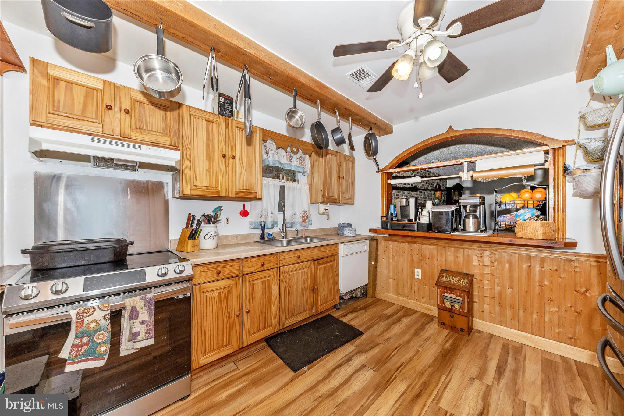 2915 Fry Road Jefferson, MD 21755 - Photo 15 of 66 a kitchen with stainless steel appliances a stove a sink dishwasher and cabinets with wooden floor