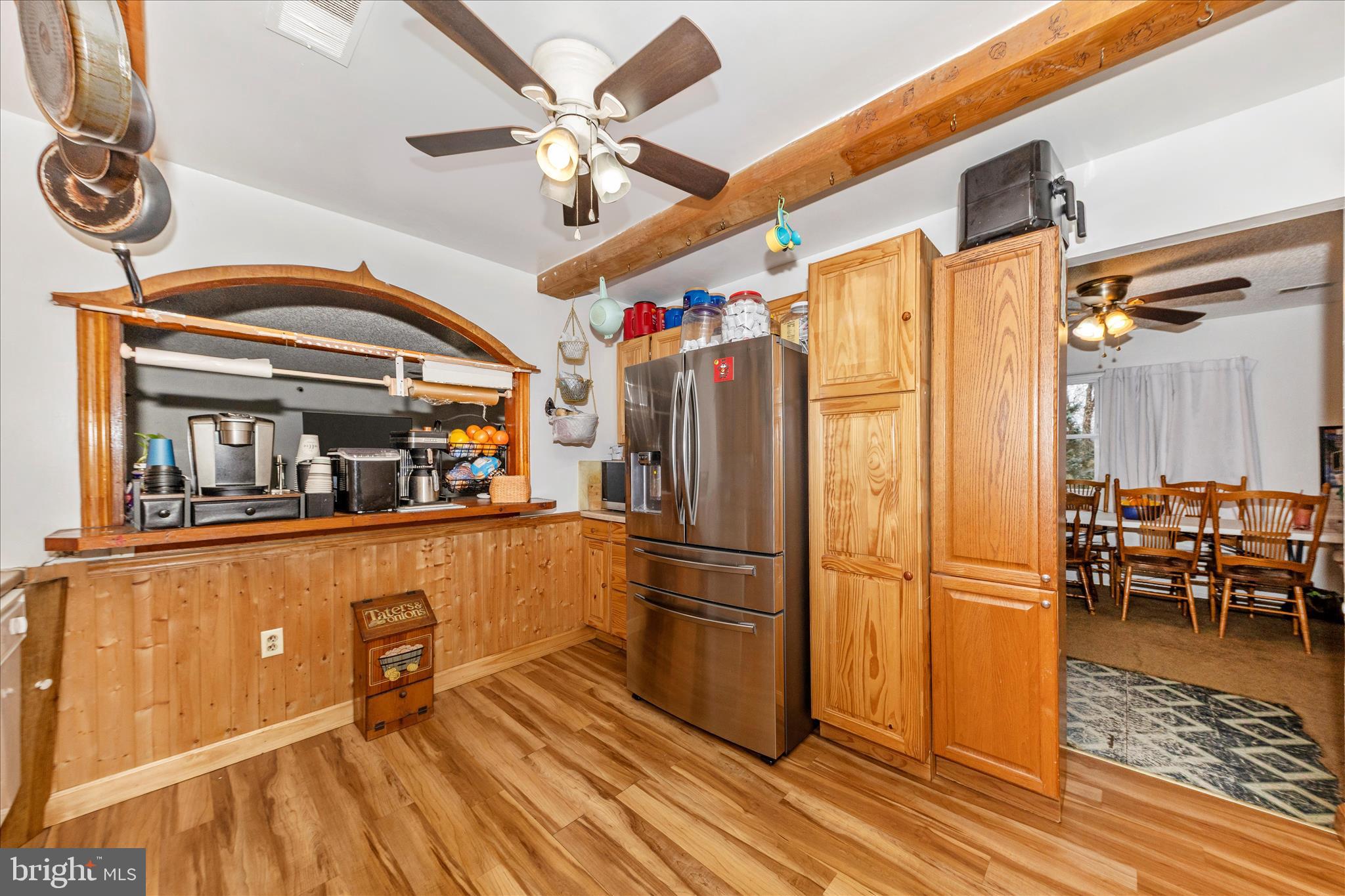 2915 Fry Road Jefferson, MD 21755 - Photo 18 of 66 a kitchen with stainless steel appliances granite countertop a refrigerator a stove and a dining table with wooden floor