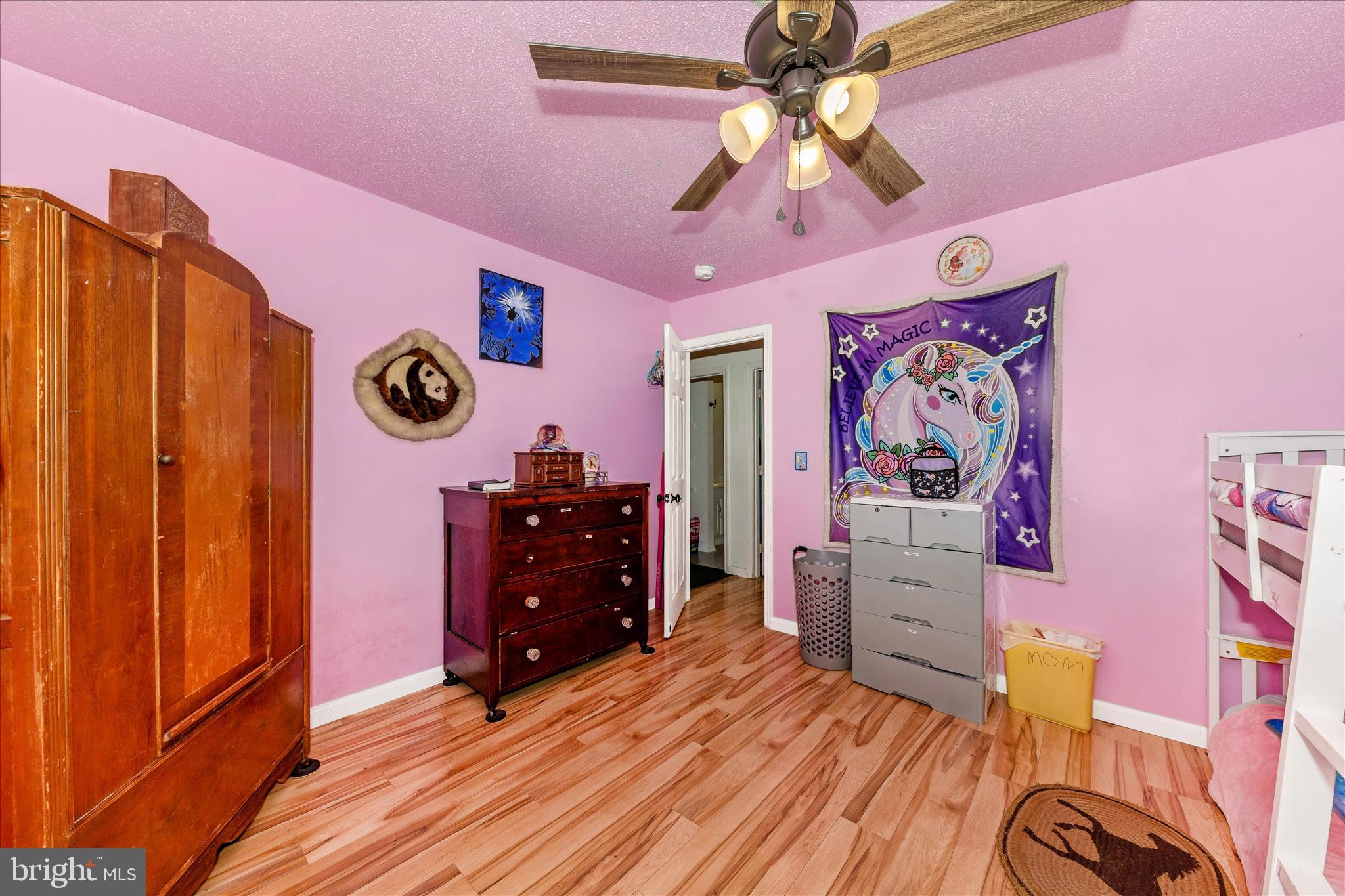 2915 Fry Road Jefferson, MD 21755 - Photo 27 of 66 a bedroom with a bed and a chandelier