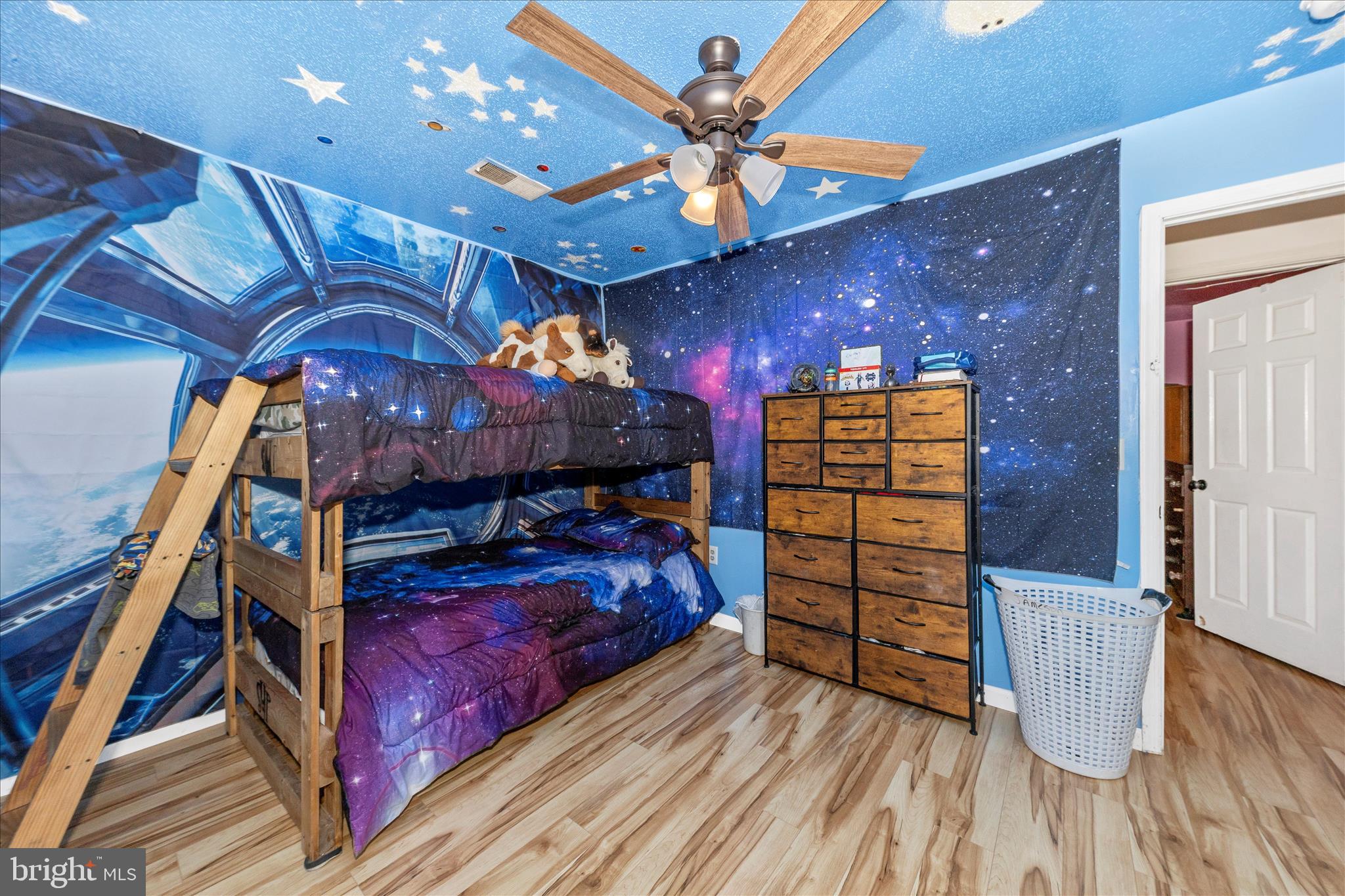 2915 Fry Road Jefferson, MD 21755 - Photo 29 of 66 a bed room with a bed and a chandelier