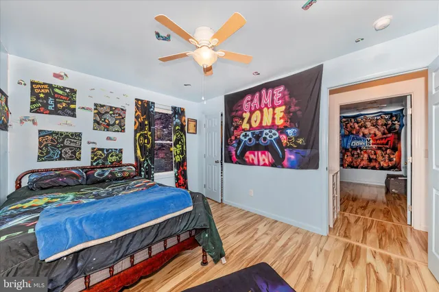 a bathroom with a sink a toilet and shower curtain
