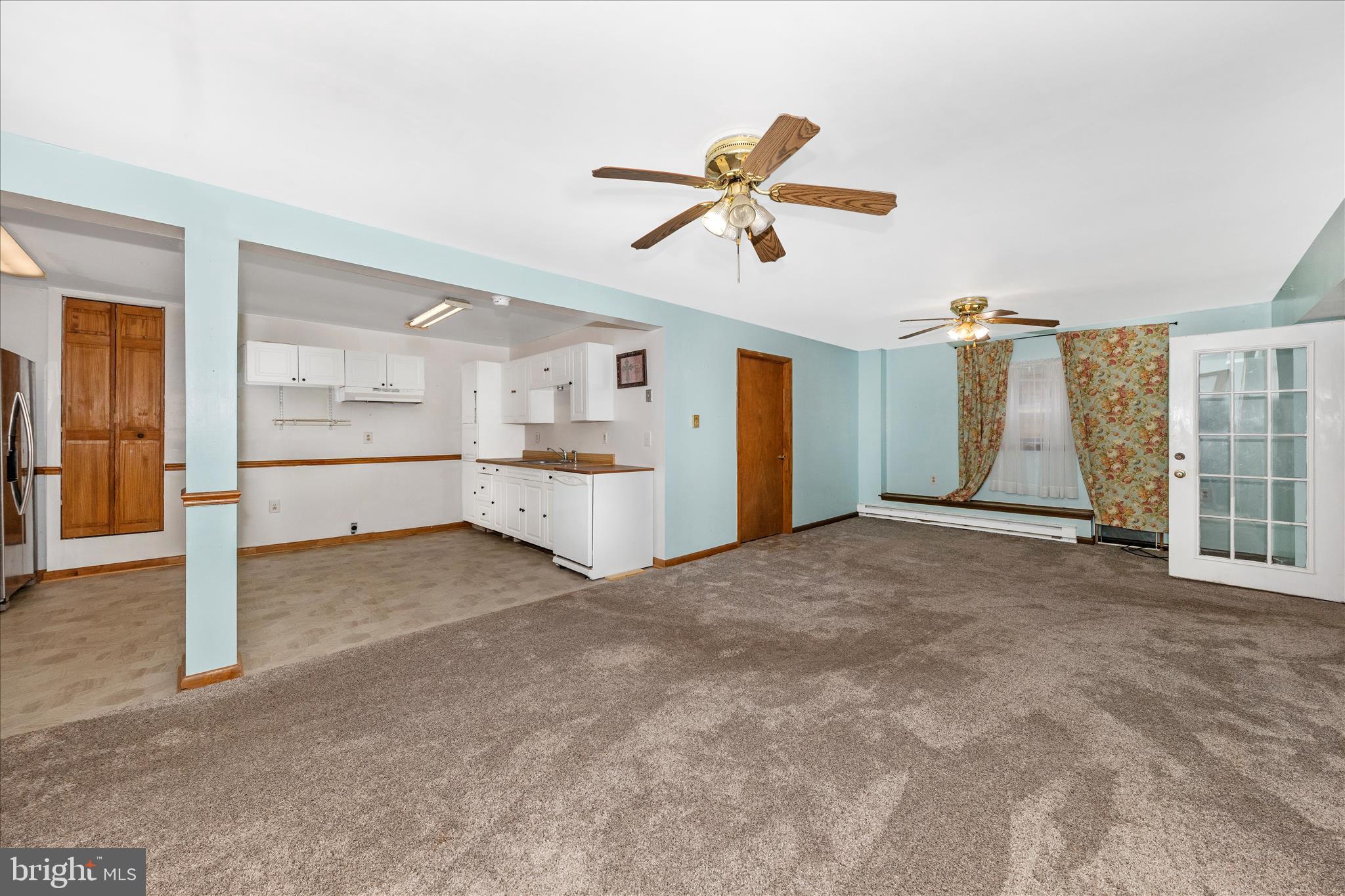 2915 Fry Road Jefferson, MD 21755 - Photo 39 of 66 a view of a big room with wooden floor and windows