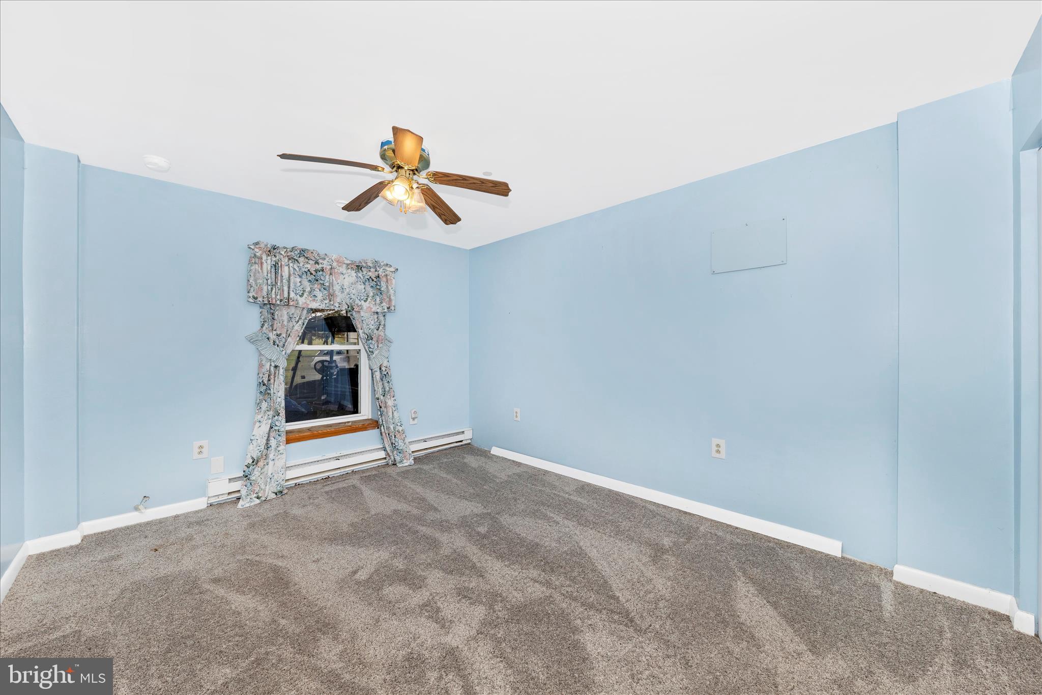 2915 Fry Road Jefferson, MD 21755 - Photo 42 of 66 a view of a livingroom with wooden floor and a ceiling fan