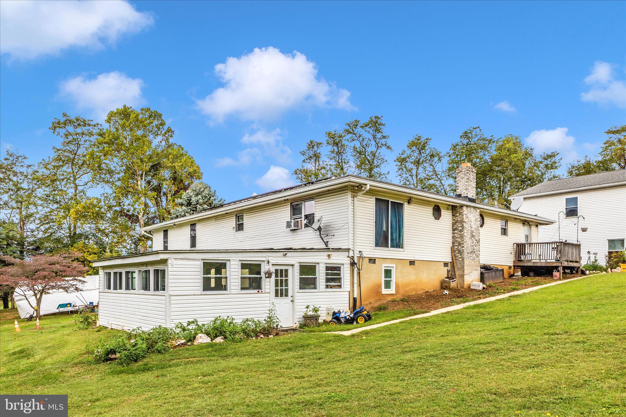 2915 Fry Road Jefferson, MD 21755 - Photo 55 of 66 a front view of a house with a garden