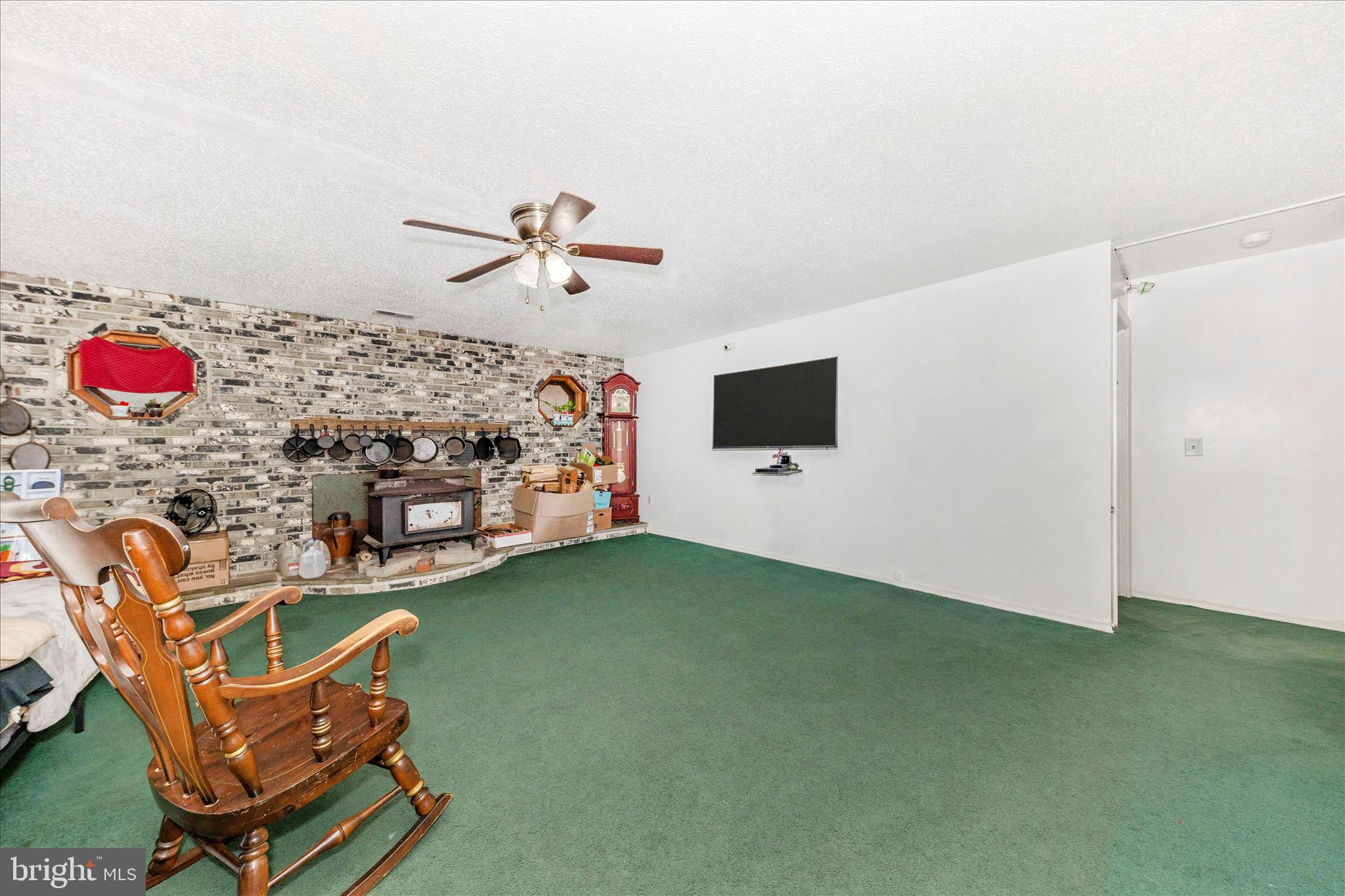 2915 Fry Road Jefferson, MD 21755 - Photo 7 of 66 a living room with furniture and a flat screen tv