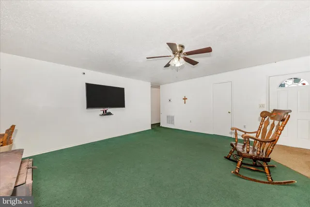 a bedroom with furniture and a chandelier