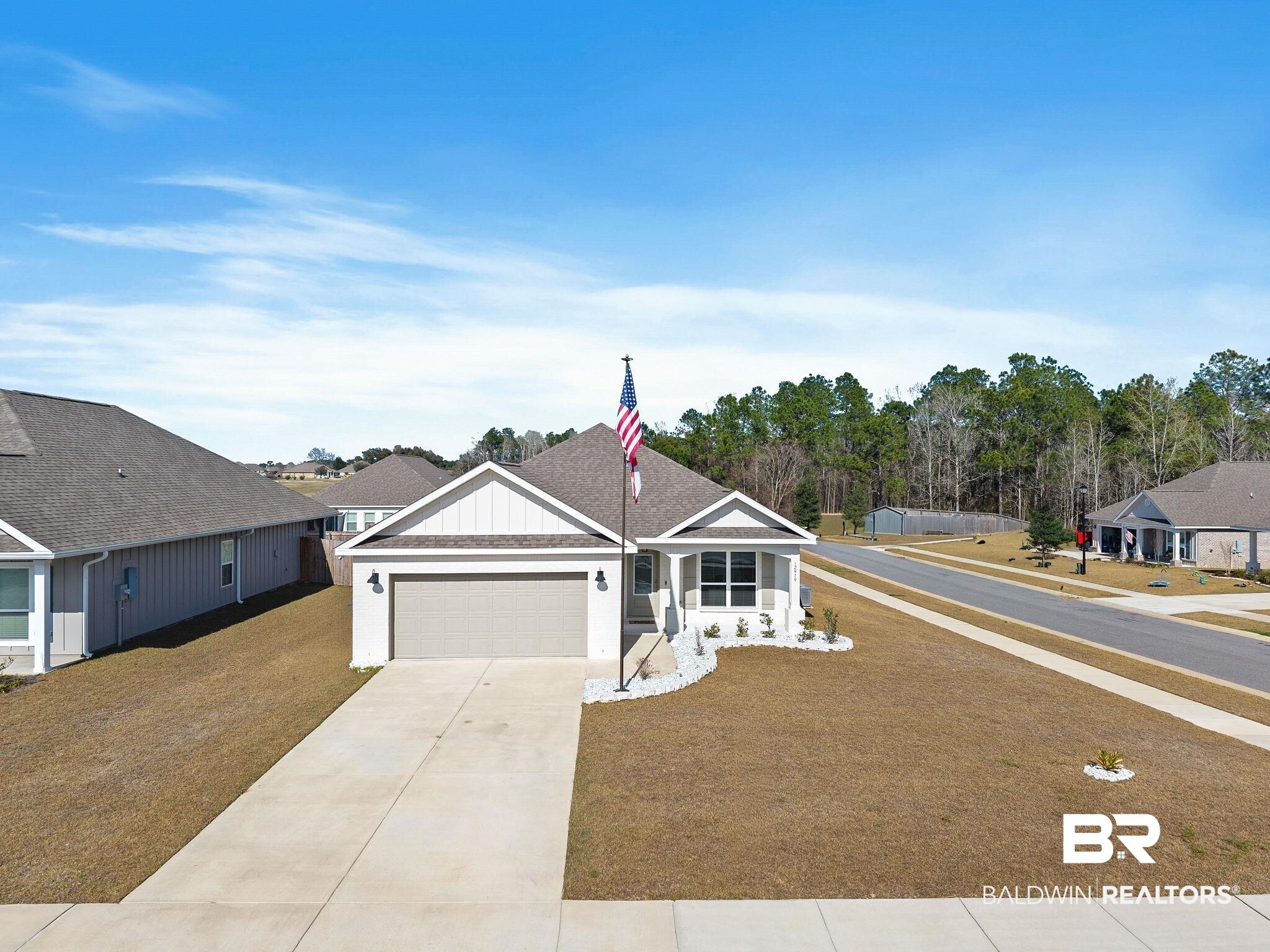 12919 Torrent Road Fairhope, AL 36532 - Photo 56 of 74 Single story home featuring driveway, an attached garage, and a front lawn