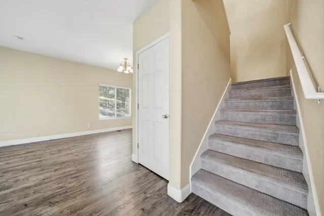a view of an entryway with wooden floor
