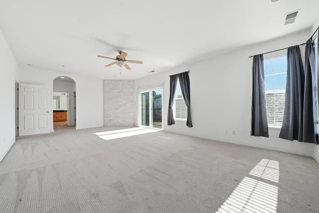 a bathroom with a granite countertop bathtub sink and mirror