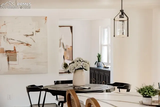 a dining room with furniture and window