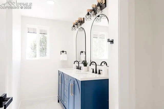 a view of an empty room with a fireplace and a window