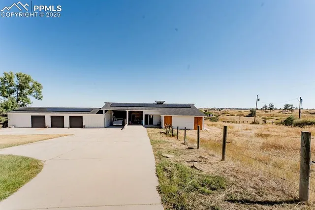 a view of a backyard of the house