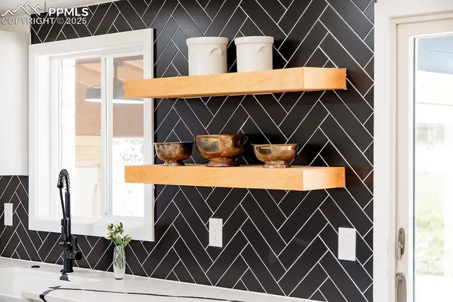 a living room with furniture and flowers