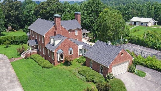 4241 Nopone Road Gainesville, GA 30506 - Photo 1 of 1 an aerial view of a house with a garden and trees