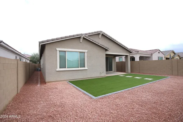 a view of a yard in front of a house with a yard