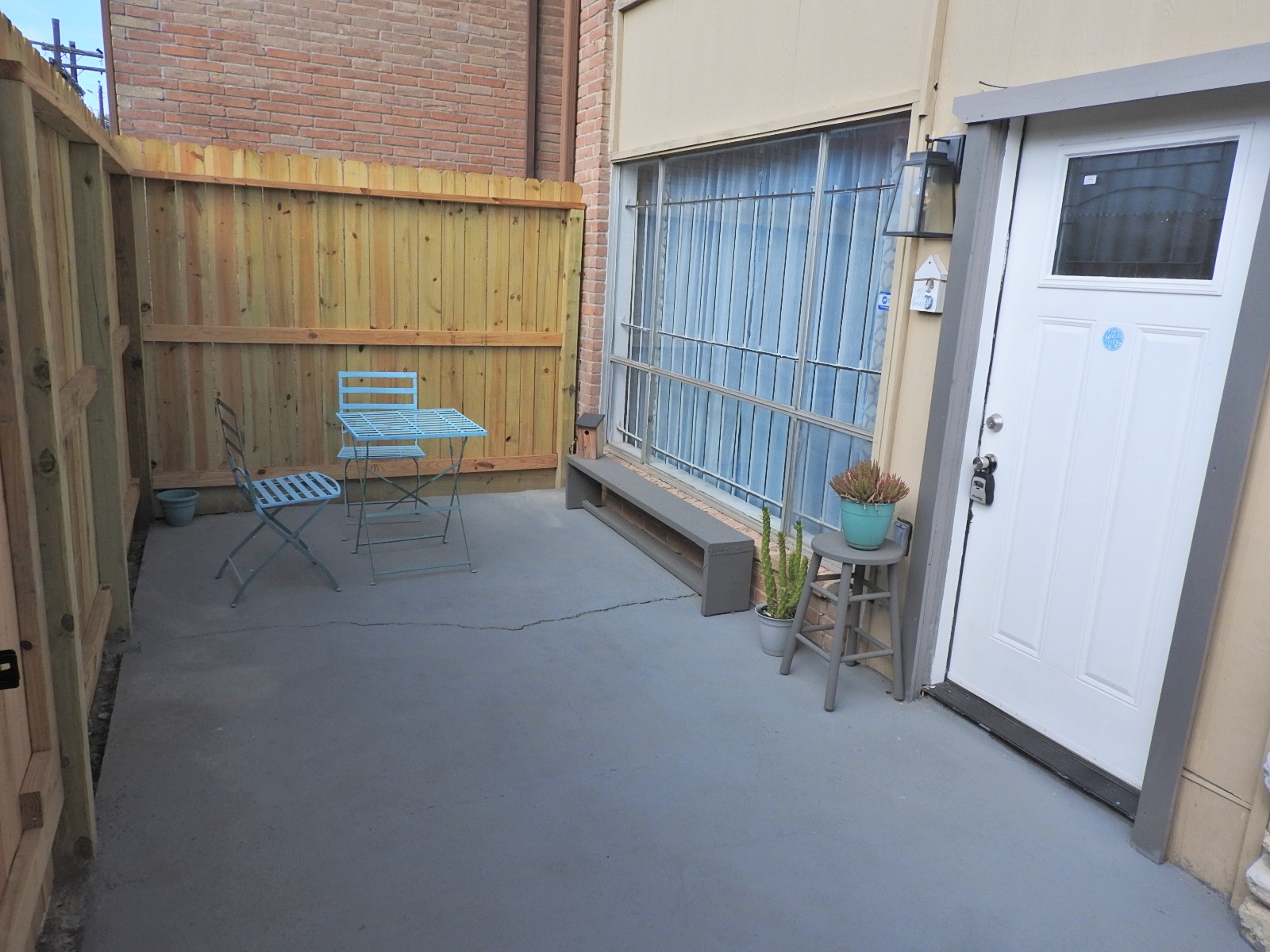 7047 Bissonnet Street, Unit 44 Houston, TX 77074 - Photo 18 of 20 a view of a backyard with a chair and table