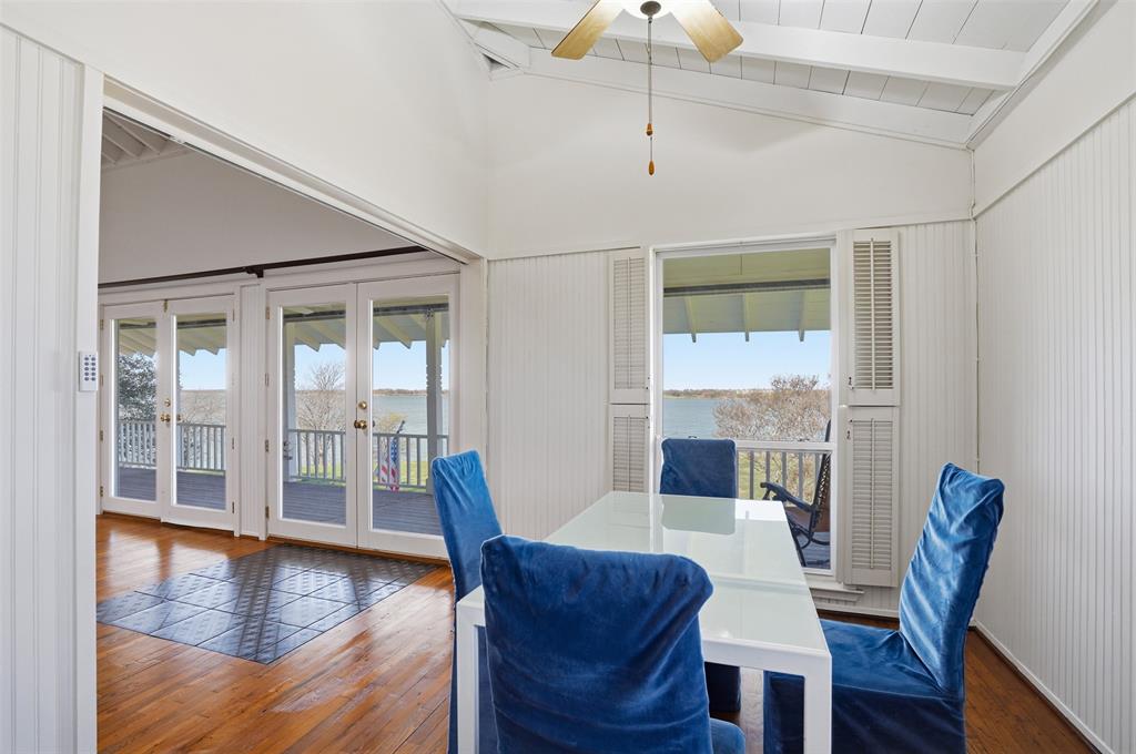 13280 Beach Club Road The Colony, TX 75056 - Photo 12 of 40 a view of a dining room with furniture wooden floor and chandelier