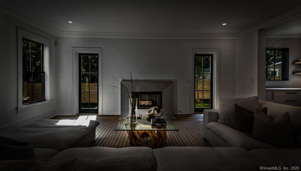 1 Deerfield Road Darien, CT 06820 - Photo 13 of 40 a living room with furniture and a fireplace