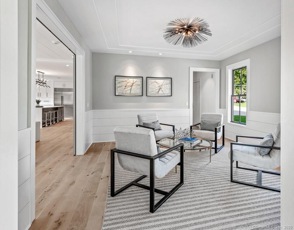 1 Deerfield Road Darien, CT 06820 - Photo 16 of 40 a living room with furniture and a wooden floor