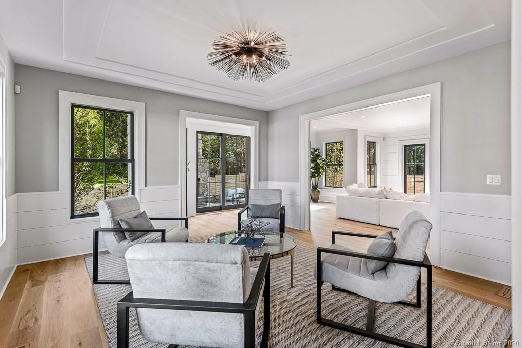 1 Deerfield Road Darien, CT 06820 - Photo 17 of 40 a living room with furniture and a large window
