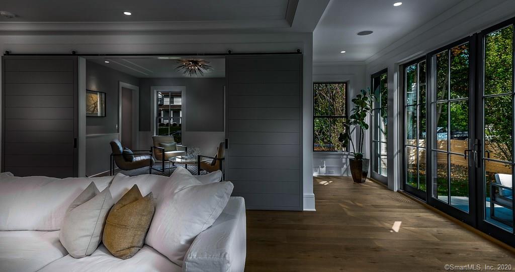 1 Deerfield Road Darien, CT 06820 - Photo 18 of 40 a view of a hallway with livingroom and furniture