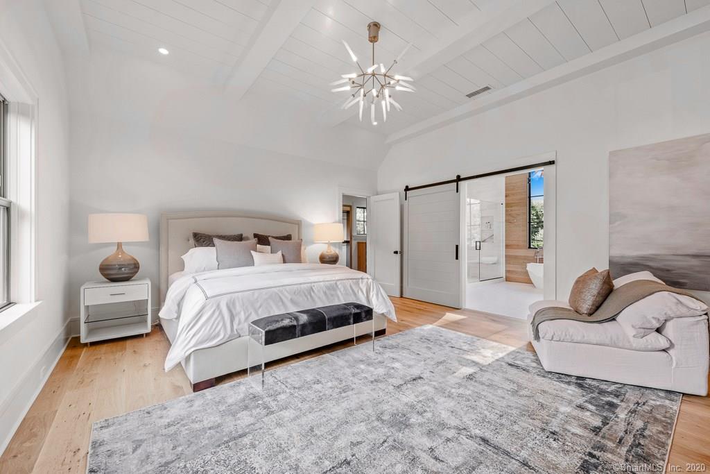 1 Deerfield Road Darien, CT 06820 - Photo 21 of 40 a bedroom with a large bed and a couch