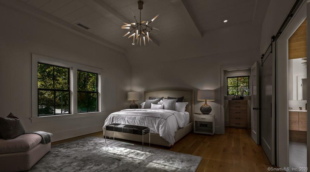1 Deerfield Road Darien, CT 06820 - Photo 22 of 40 a bedroom with a bed and a window