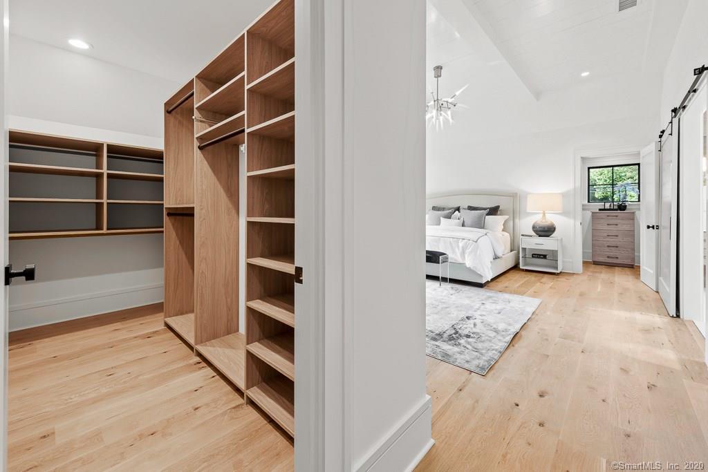 1 Deerfield Road Darien, CT 06820 - Photo 26 of 40 a view of a bedroom with closet and cabinet