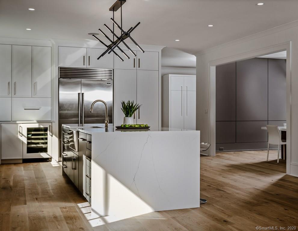 1 Deerfield Road Darien, CT 06820 - Photo 4 of 40 a kitchen with stainless steel appliances a refrigerator and a stove top oven
