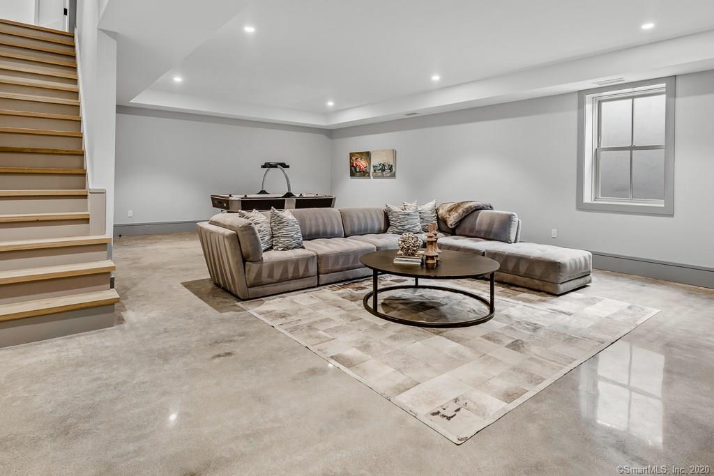 1 Deerfield Road Darien, CT 06820 - Photo 35 of 40 a living room with furniture and a window