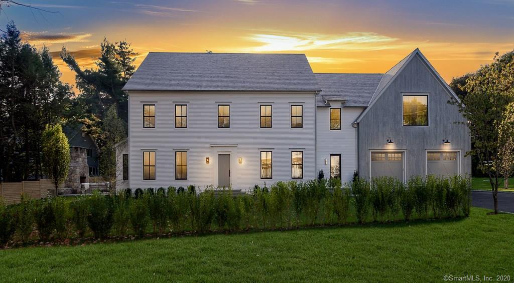 1 Deerfield Road Darien, CT 06820 - Photo 40 of 40 a front view of a house with a garden