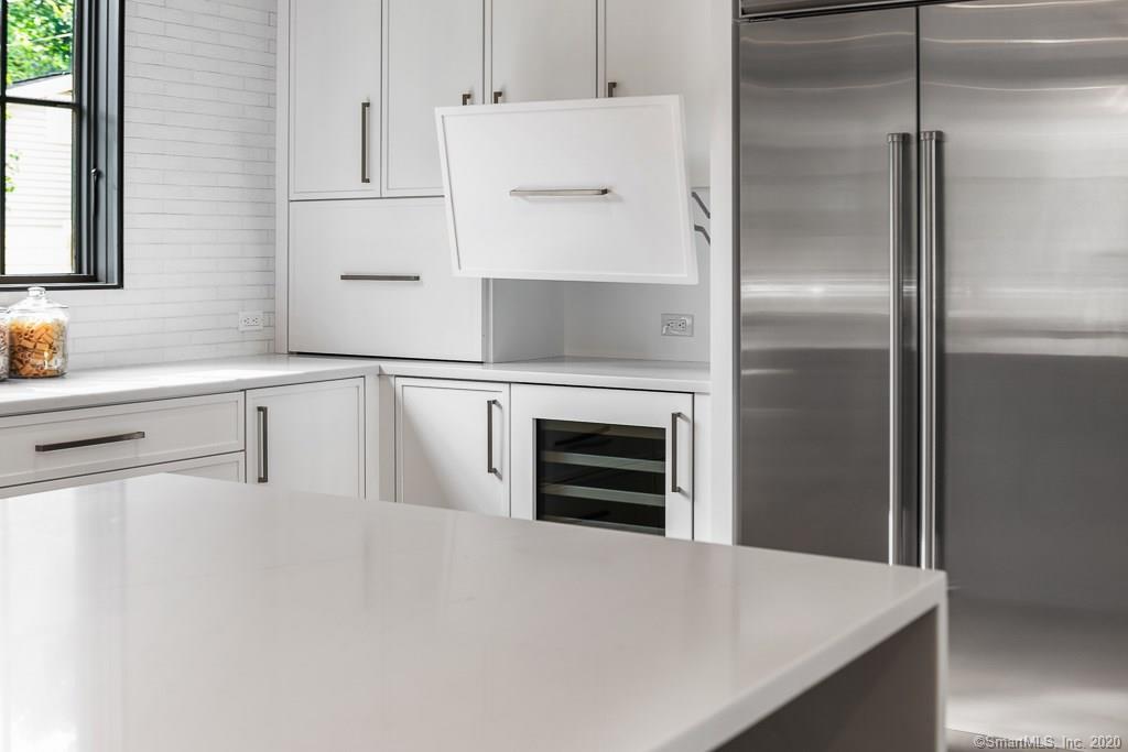 1 Deerfield Road Darien, CT 06820 - Photo 7 of 40 a close view of a refrigerator in kitchen and wooden floor
