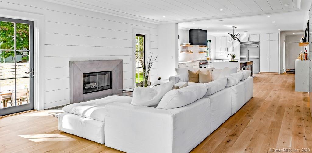 1 Deerfield Road Darien, CT 06820 - Photo 8 of 40 a living room with furniture and a fireplace