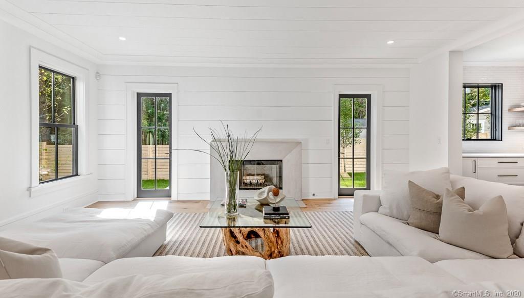 1 Deerfield Road Darien, CT 06820 - Photo 9 of 40 a living room with furniture or couch and a fireplace