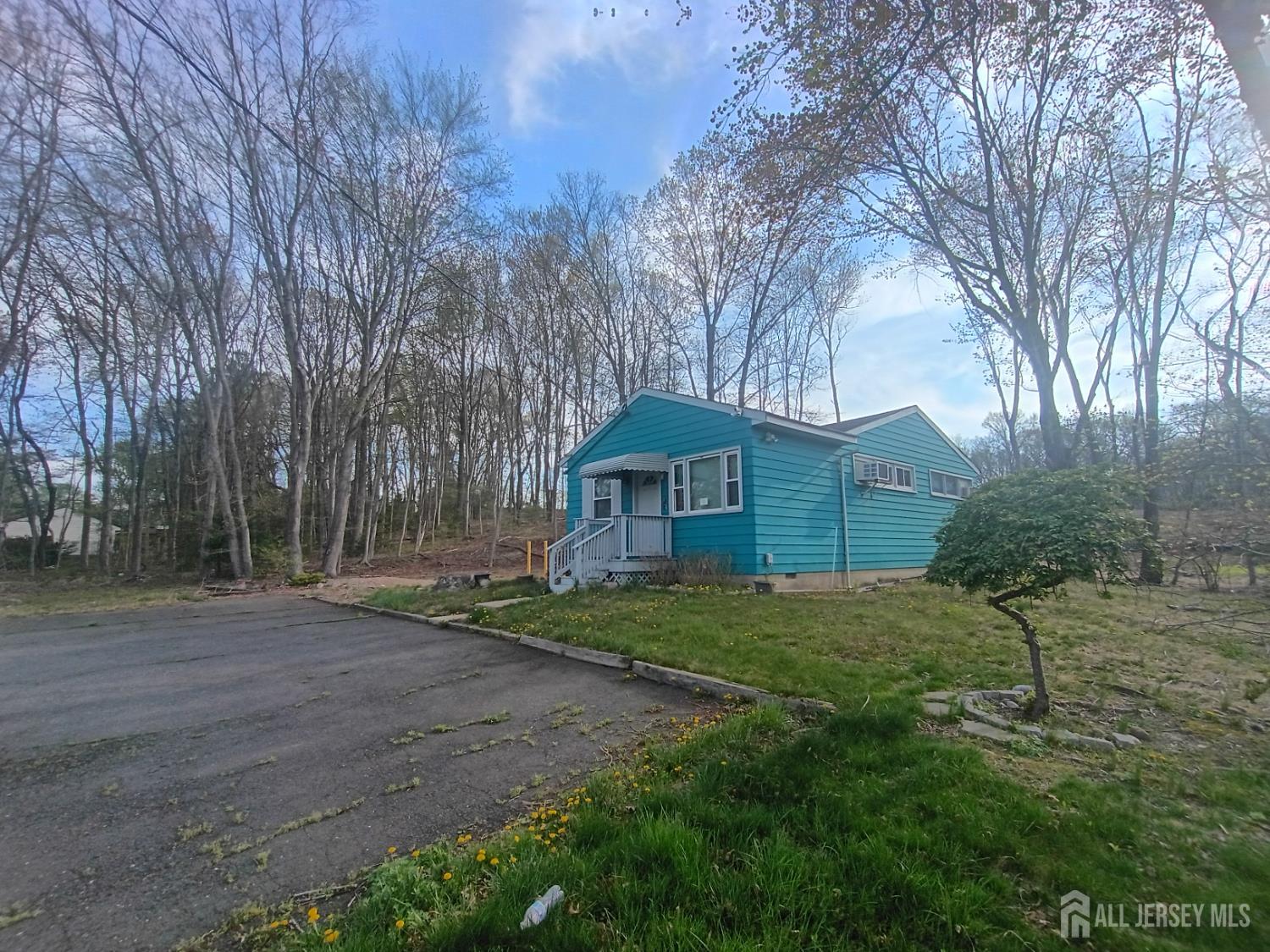 90 Spring Hill Road Old Bridge, NJ 07747 - Photo 2 of 6 a view of a house with a yard