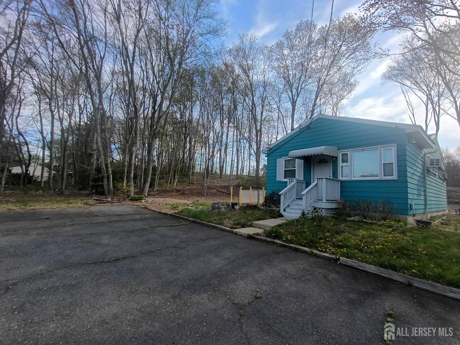 90 Spring Hill Road Old Bridge, NJ 07747 - Photo 5 of 6 a front view of a house with a yard