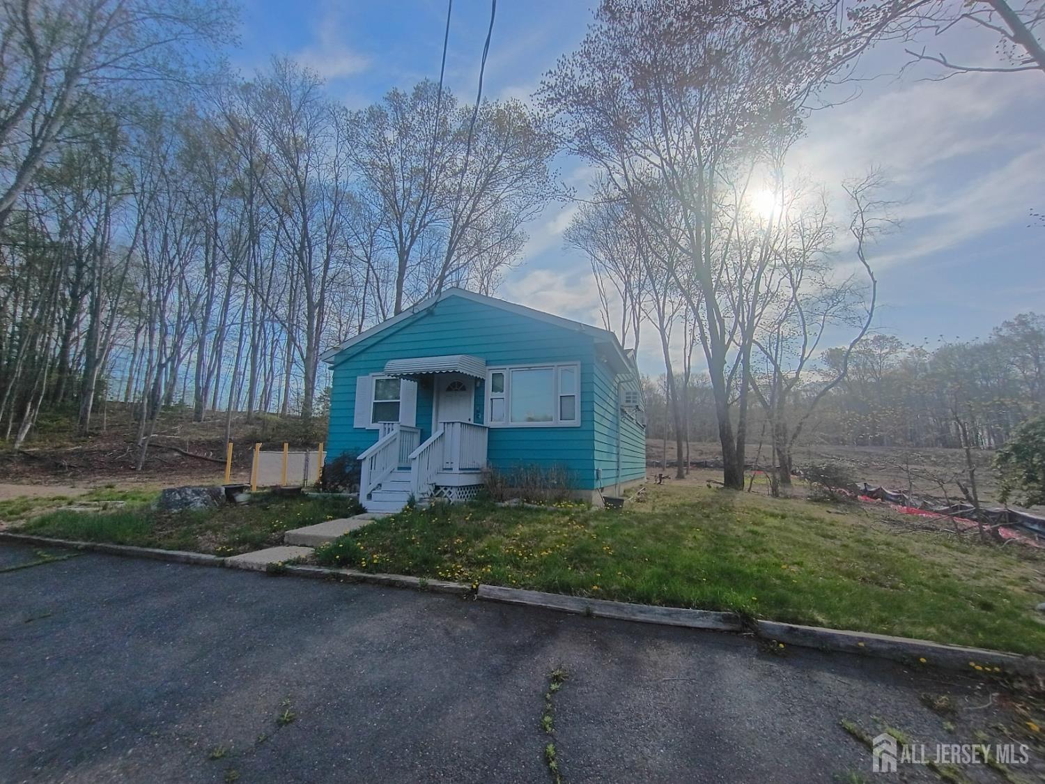 90 Spring Hill Road Old Bridge, NJ 07747 - Photo 6 of 6 a front view of a house with a yard