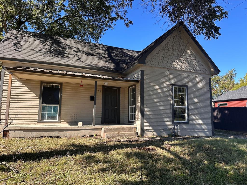 115 1st Street Terrell, TX 75160 - Photo 3 of 9 a front view of a house with a yard