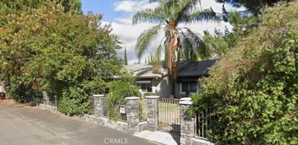 a view of a house with a tree