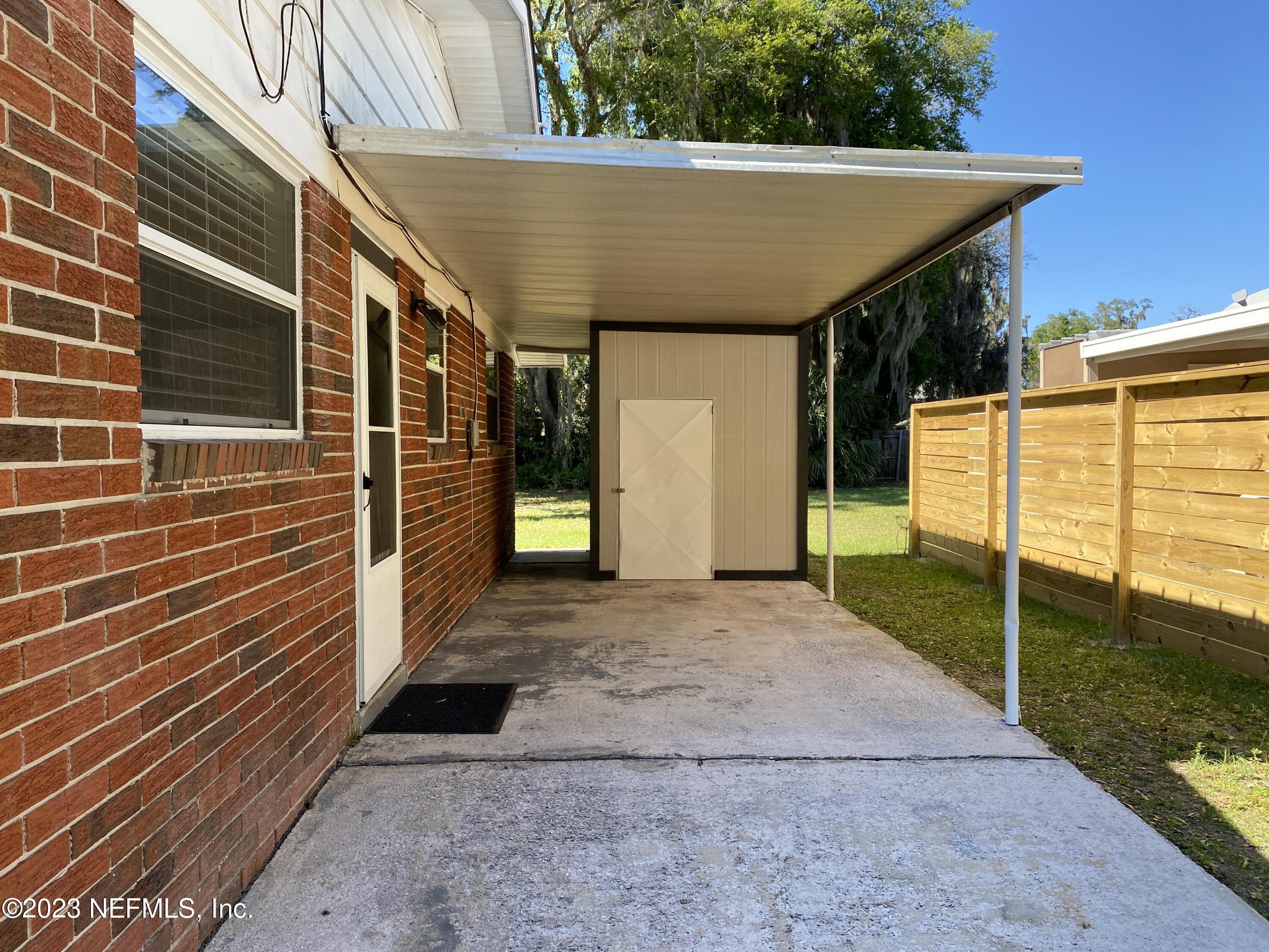 102 St Elmo Road Green Cove Springs, FL 32043 - Photo 3 of 15 a view of a house with backyard