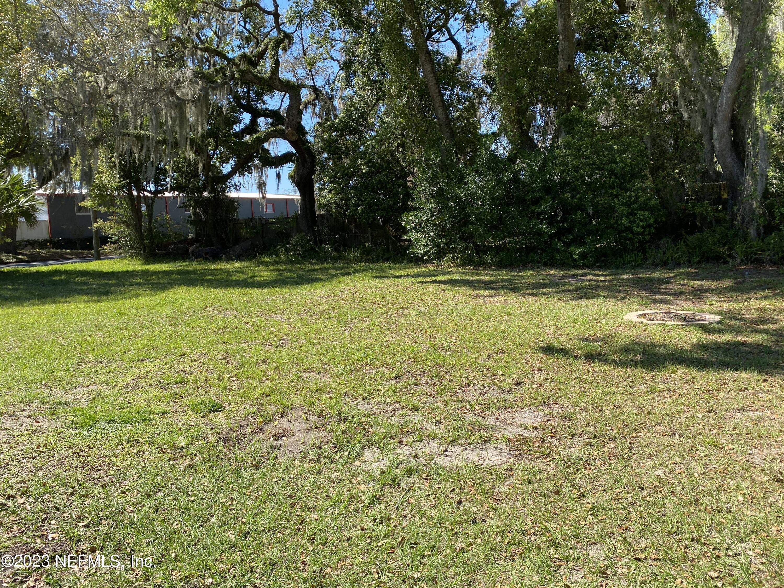 102 St Elmo Road Green Cove Springs, FL 32043 - Photo 10 of 15 a view of a swimming pool and trees in the background