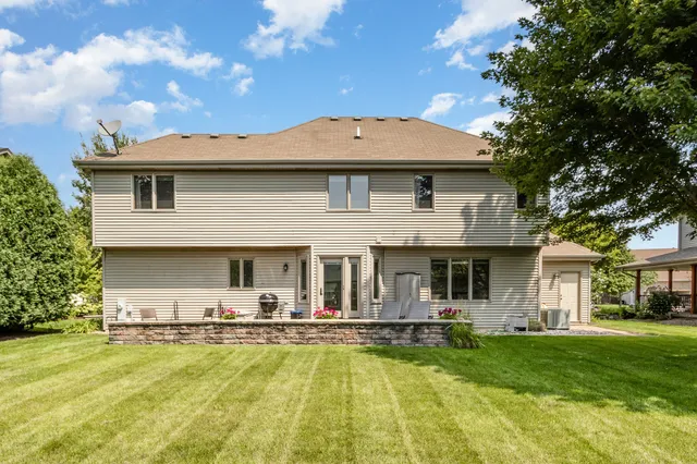 a front view of a house with swimming pool having outdoor seating