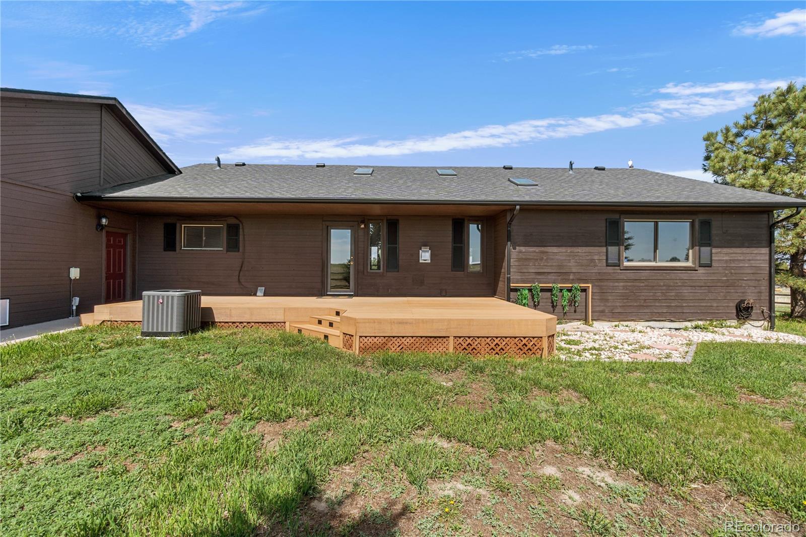74 Rocky Cliff Road Elizabeth, CO 80107 - Photo 39 of 50 a front view of a house with a yard