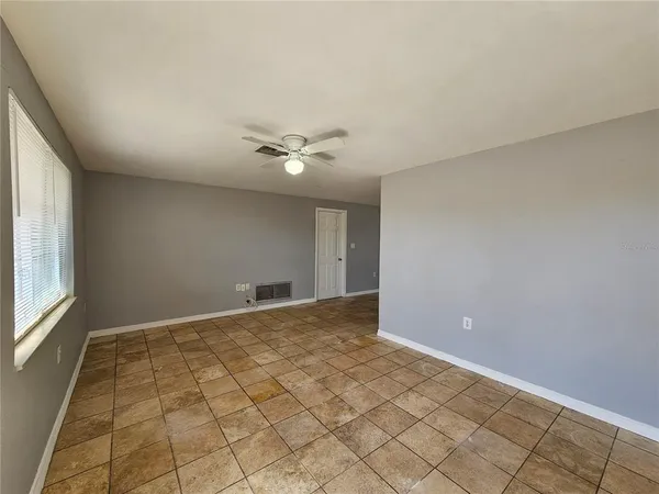 a view of an empty room and window
