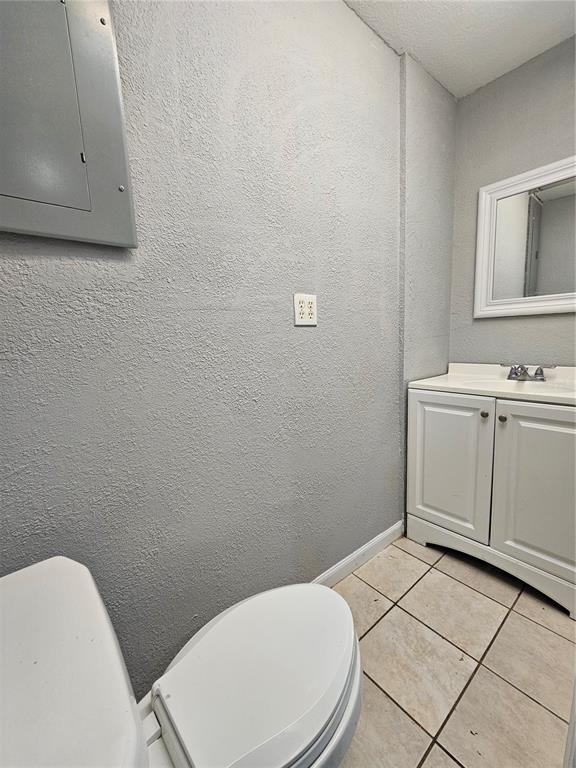 3029 Kilburn Road Holiday, FL 34691 - Photo 10 of 19 a white toilet sitting next to a bathroom sink