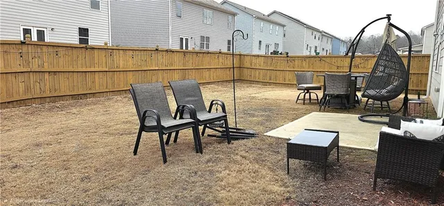 a view of a chairs and table in the patio