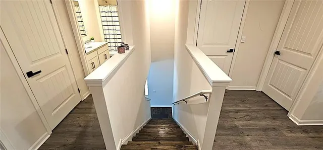 a view of a hallway with windows